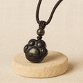 Pendentif Patte Lien Éternel en Obsidienne Dorée - Jardin de Gaïa